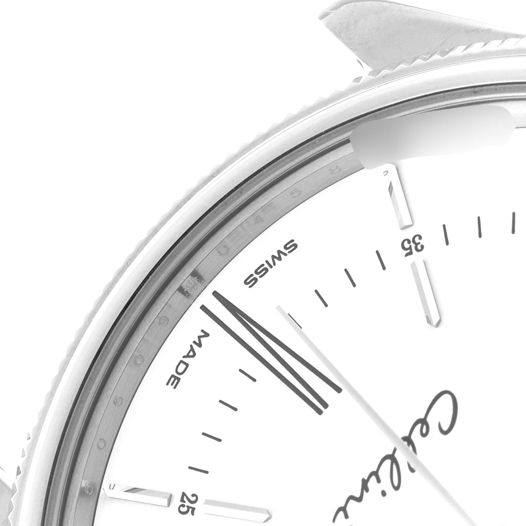 This close-up image shows the upper part of the watch face of the Rolex Cellini 50509 Men's Stainless Steel White Dial 50509 Men's Stainless Steel White Dial model, highlighting the text and minute markers.