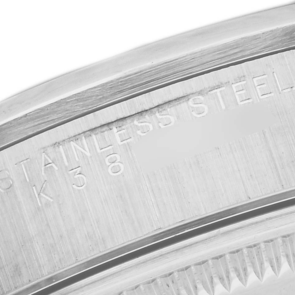 This close-up image shows the detailed engraving on the stainless steel casing back of a Rolex Date 15200 Men
s Stainless Steel Black Dial 15200 Men
s Stainless Steel Black Dial model watch.