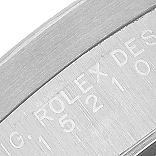 The image shows a close-up of the inner bezel and serial number of a Rolex Date 15210 Men's Stainless Steel Blue Dial 15210 Men's Stainless Steel Blue Dial model watch.