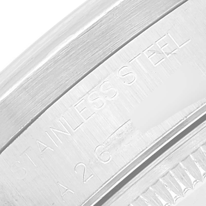 The image shows a close-up of the stainless steel casing and engraved details of a Rolex Date 15210 Men's Stainless Steel Silver Dial 15210 Men's Stainless Steel Silver Dial model watch.