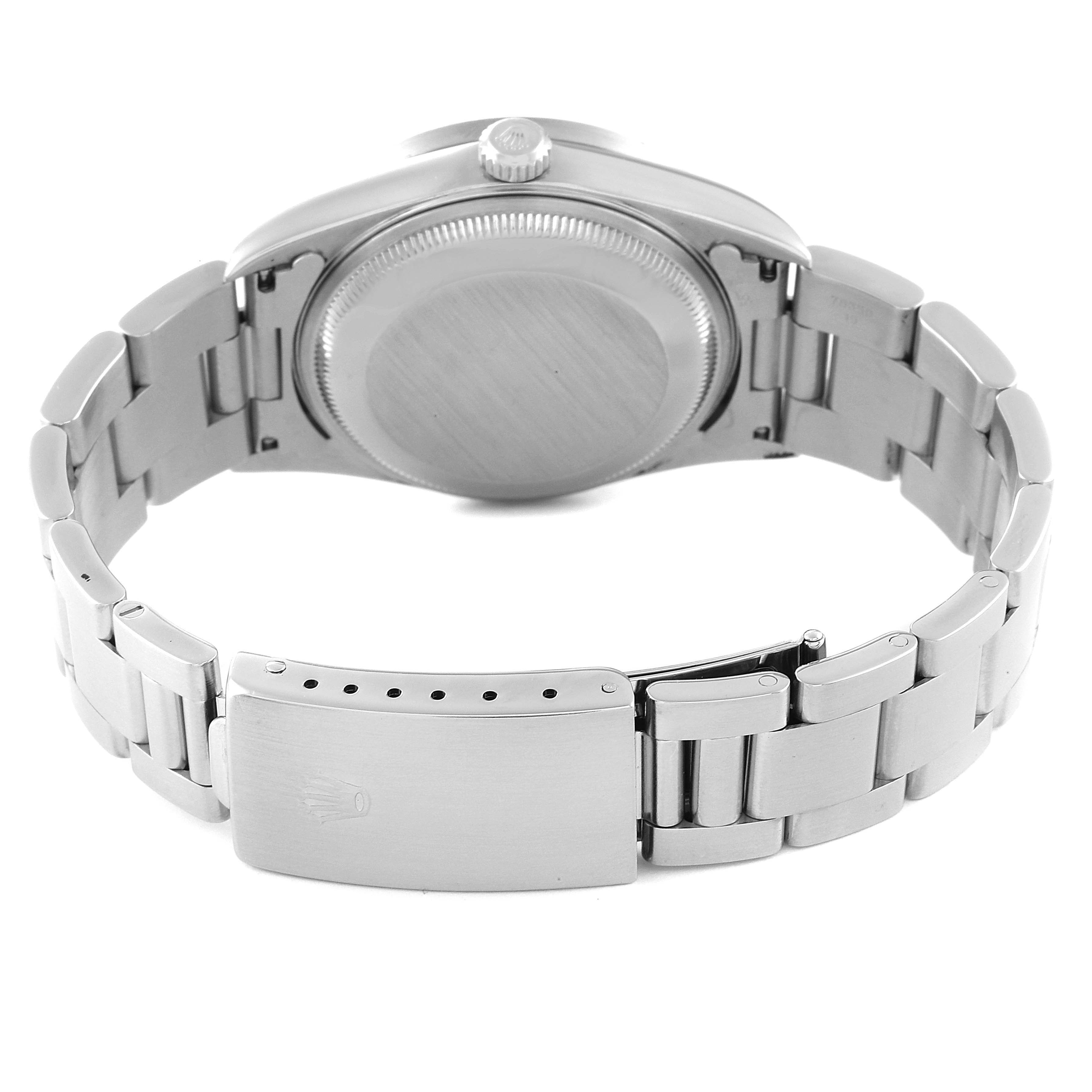 The image shows the back of a Rolex Date 15210 Men's Stainless Steel Silver Dial 15210 Men's Stainless Steel Silver Dial model watch, highlighting the case back, crown, and bracelet with clasp.