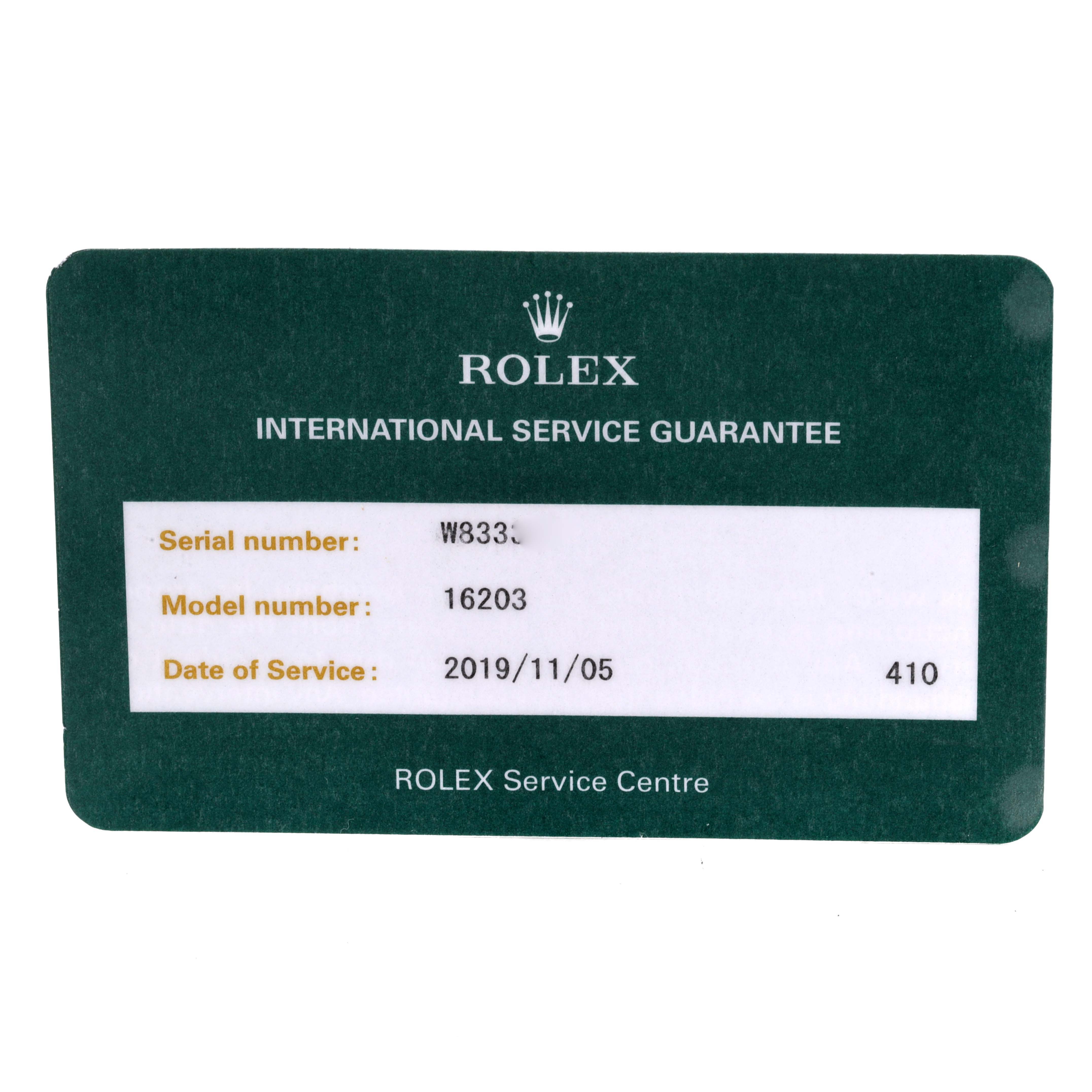 The image shows a Rolex international service guarantee card for a Datejust model 16203.