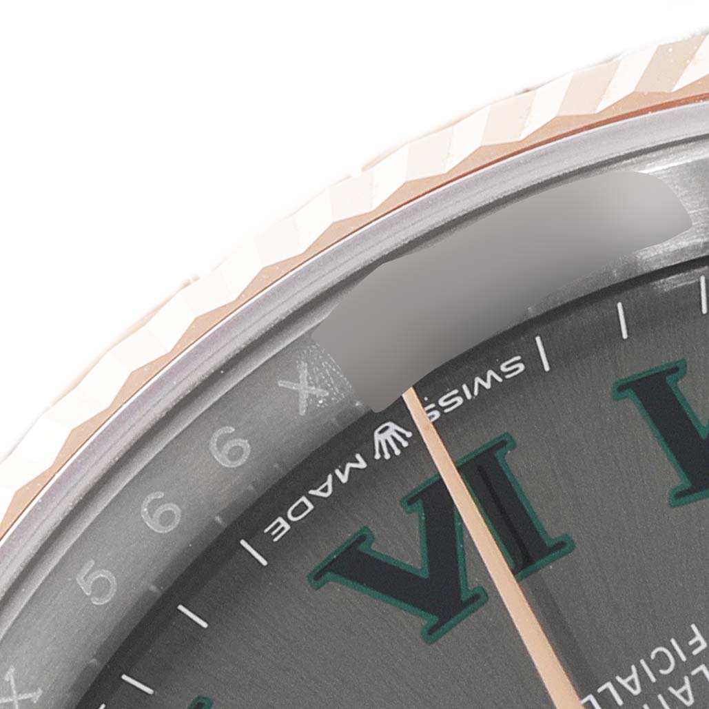 This image shows a close-up of the bezel and part of the face, including the "SWISS MADE" text, on the Rolex Datejust 126231 Men's Steel and Gold (two tone) Grey Dial 126231 Men's Steel and Gold (two tone) Grey Dial watch.