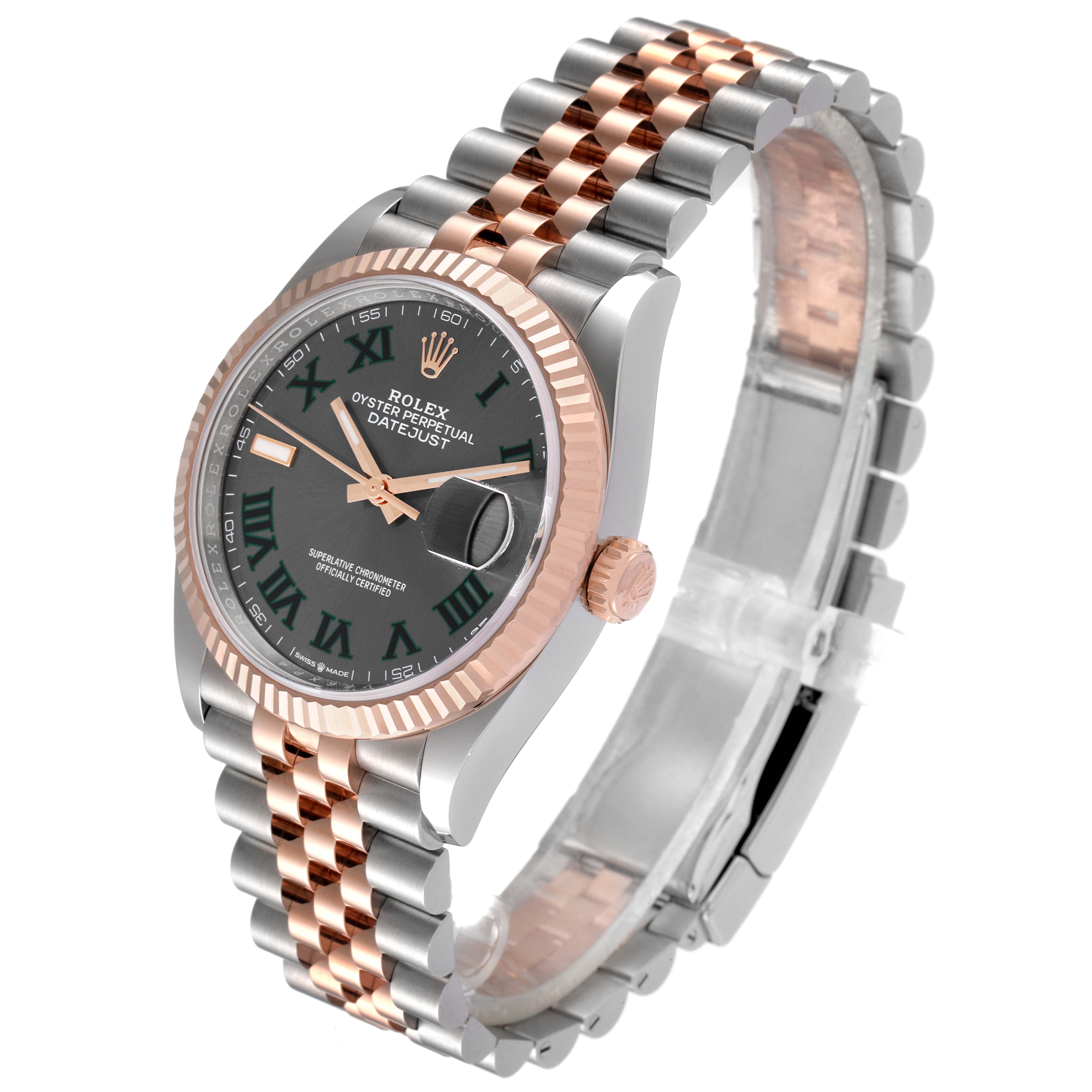 This image shows a Rolex Datejust 126231 Men's Steel and Gold (two tone) Grey Dial 126231 Men's Steel and Gold (two tone) Grey Dial watch at an angled view, highlighting its two-tone bracelet, fluted bezel, and green dial.