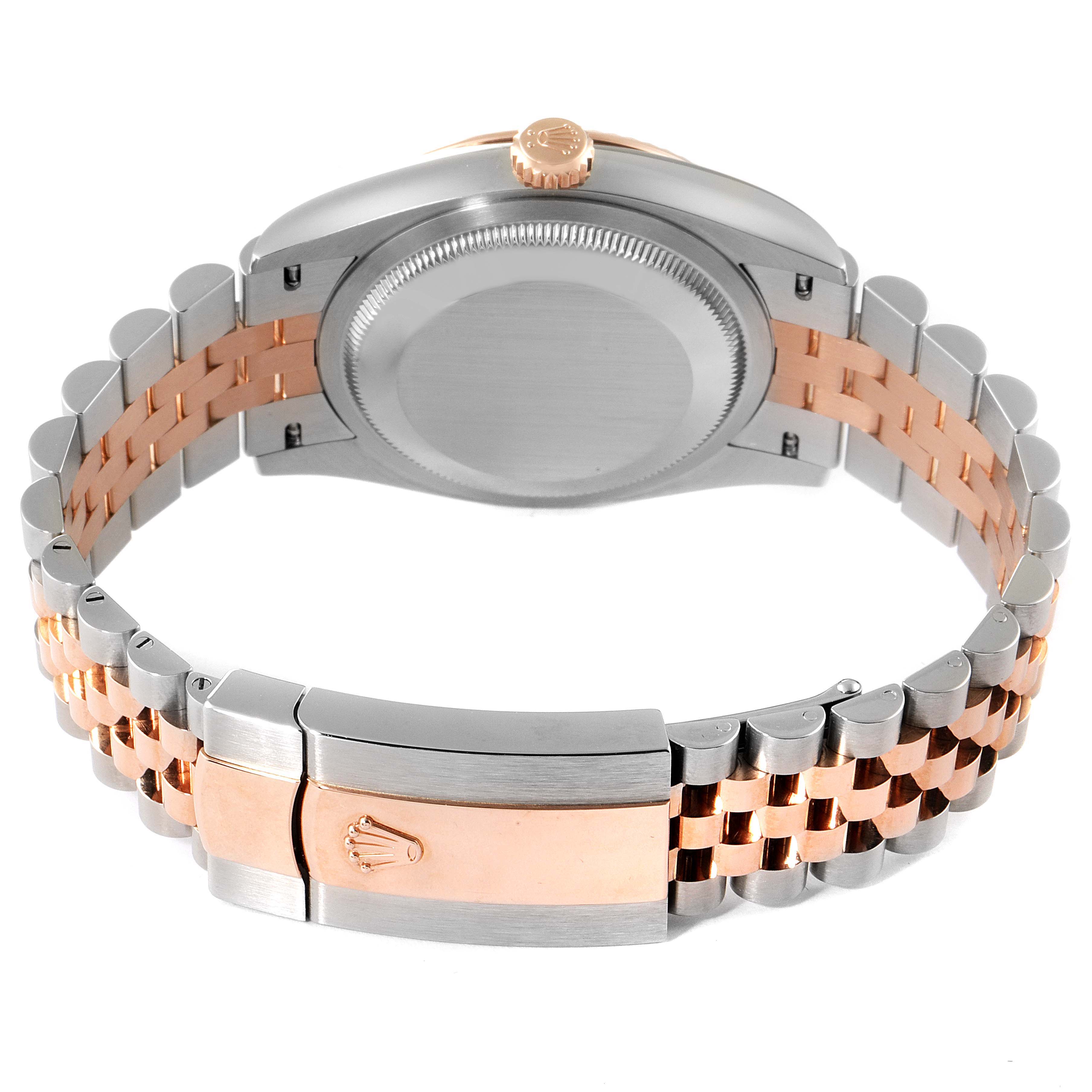 The image shows the back view of a Rolex Datejust 126231 Men
s Steel and Gold (two tone) Grey Dial 126231 Men
s Steel and Gold (two tone) Grey Dial watch, focusing on the case, crown, and two-tone bracelet with a clasp.