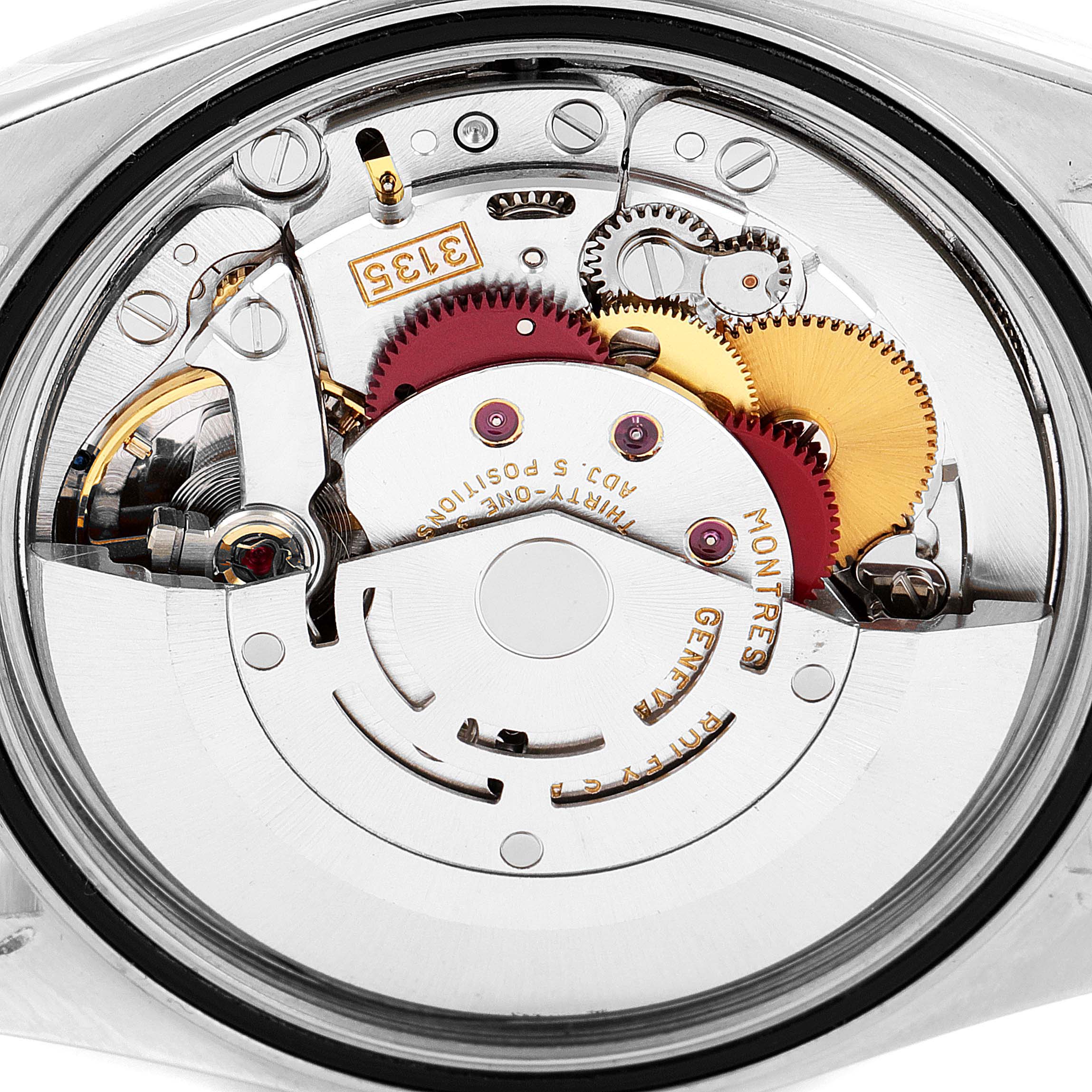 This image shows the internal mechanism of a Rolex Datejust 16203 Men's Steel and Gold (two tone) Grey Dial 16203 Men's Steel and Gold (two tone) Grey Dial watch from a top-down angle, highlighting gears and components.