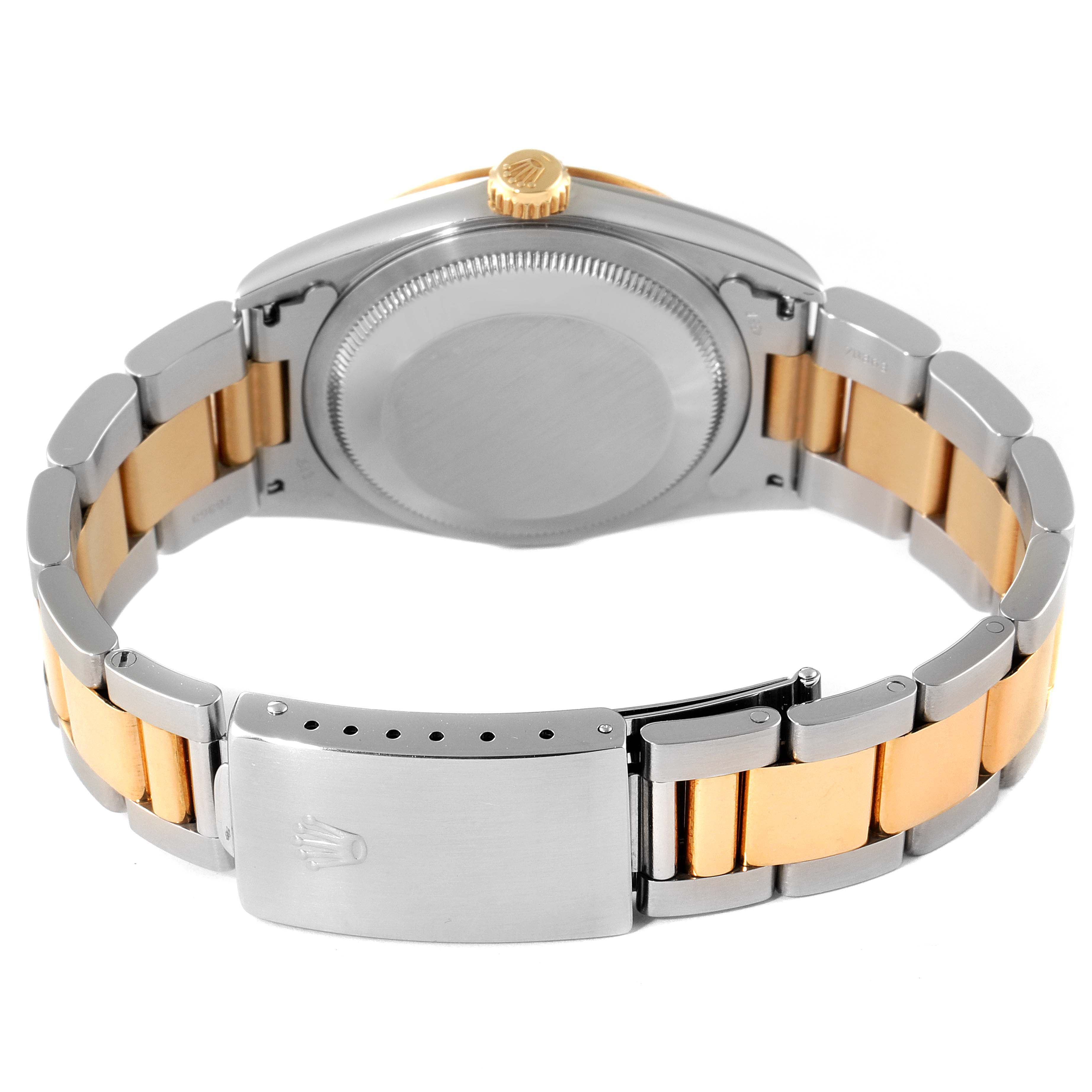 The Rolex Datejust 16203 Men's Steel and Gold (two tone) Grey Dial 16203 Men's Steel and Gold (two tone) Grey Dial watch is shown from the back, highlighting the case back, crown, and two-tone bracelet with clasp.