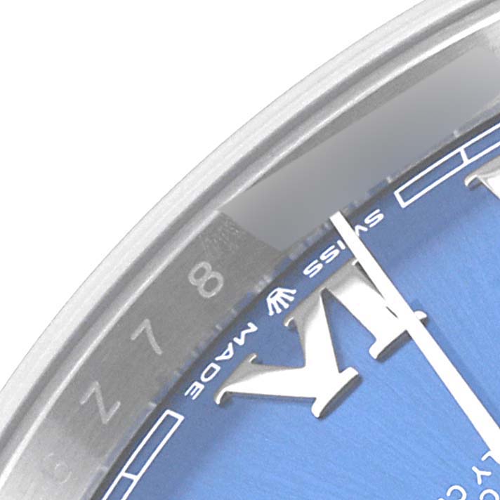 The image shows a close-up of the Rolex Datejust 41 126300 Men's Stainless Steel Blue Dial 126300 Men's Stainless Steel Blue Dial watch face, focusing on the "Swiss Made" text, numeral 8, and part of the minute hand.