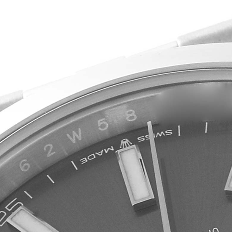 This image shows a partial close-up of the dial and chapter ring of the Rolex Datejust 41 126300 Men's Stainless Steel Grey Dial 126300 Men's Stainless Steel Grey Dial watch, focusing on the hour markers and "Swiss Made" text.