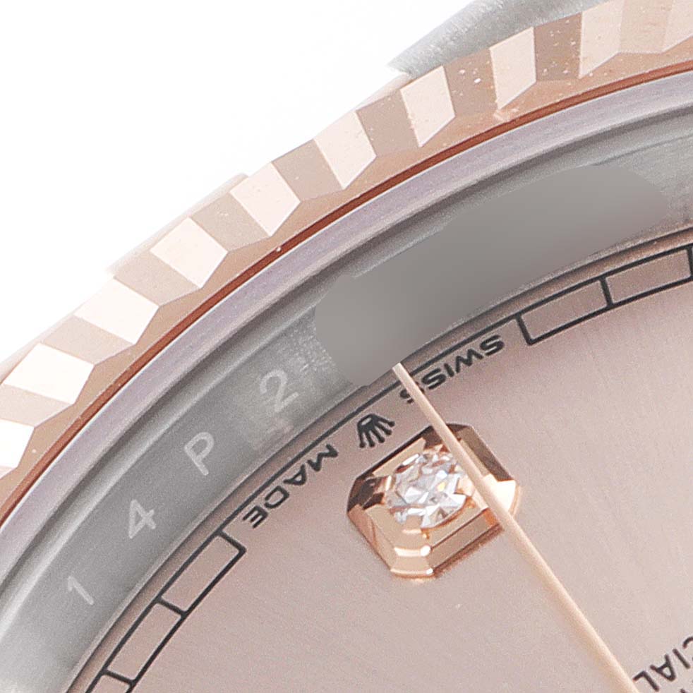The image shows a close-up of the Rolex Datejust 41 126331 Men's Steel and Gold (two tone) Beige Dial 126331 Men's Steel and Gold (two tone) Beige Dial watch bezel, part of the dial, and hour marker.