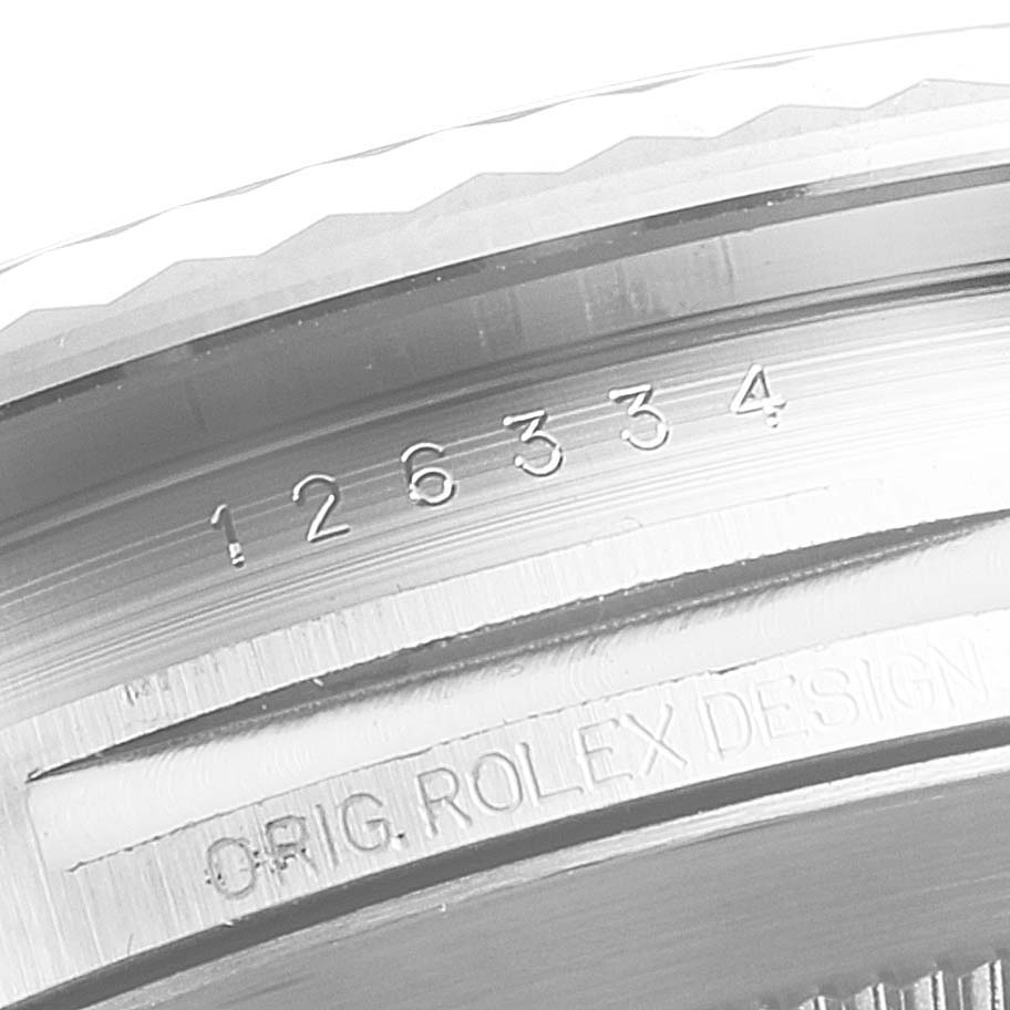 The image shows a close-up of the bezel and inner engraving of a Rolex Datejust 41 126334 Men's Stainless Steel Mother of Pearl Dial 126334 Men's Stainless Steel Mother of Pearl Dial model, highlighting its model number and brand inscription.