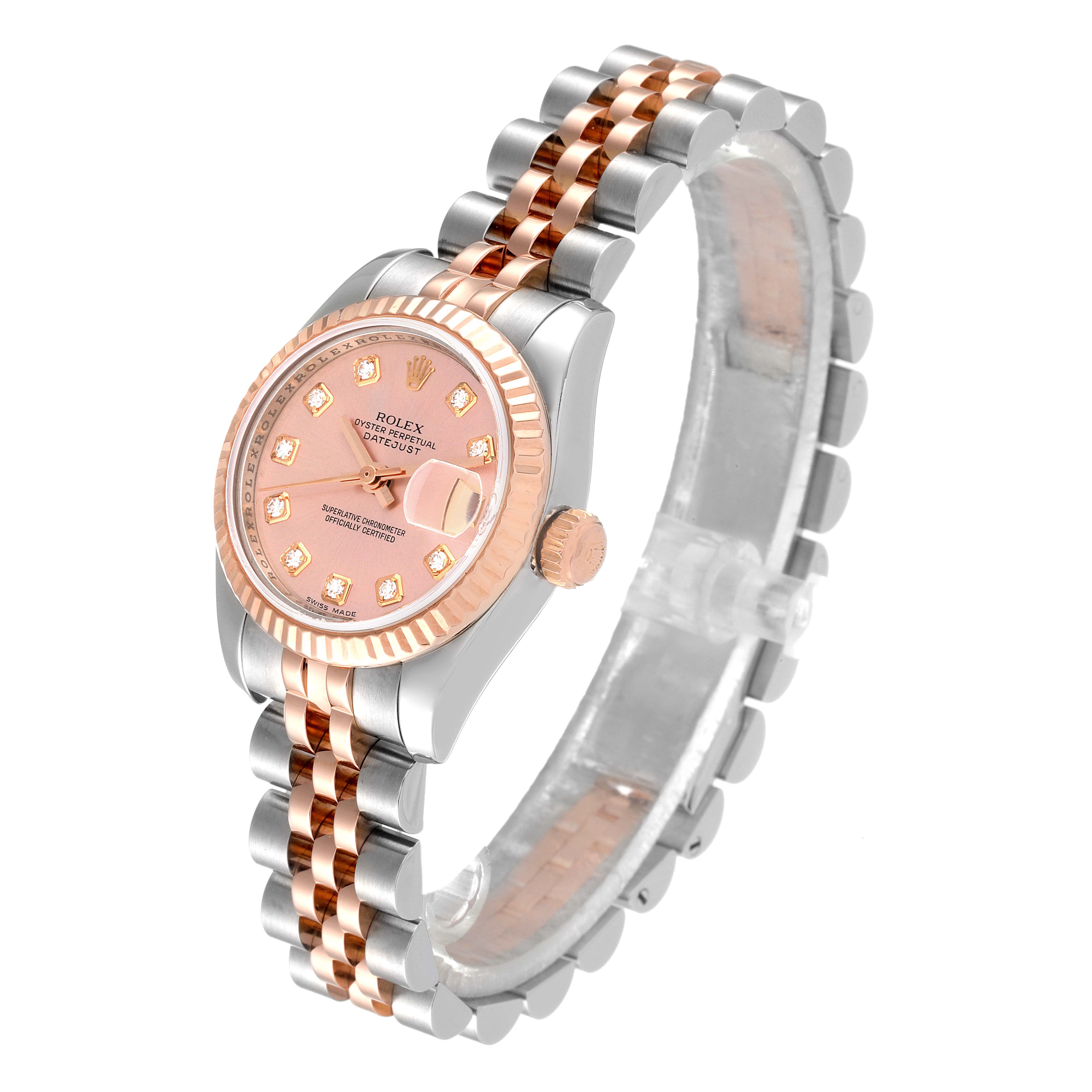 This image shows a Rolex Datejust 179171 Women's Steel and Gold (two tone) Pink Dial 179171 Women's Steel and Gold (two tone) Pink Dial watch at an angle, displaying the face, bezel, crown, and two-tone bracelet.