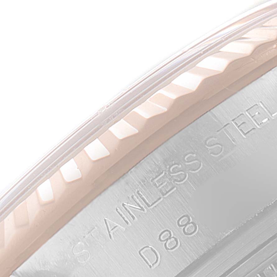 Close-up of the stainless steel bezel and engraving of a Rolex Datejust 179171 Women's Steel and Gold (two tone) Pink Dial 179171 Women's Steel and Gold (two tone) Pink Dial watch.