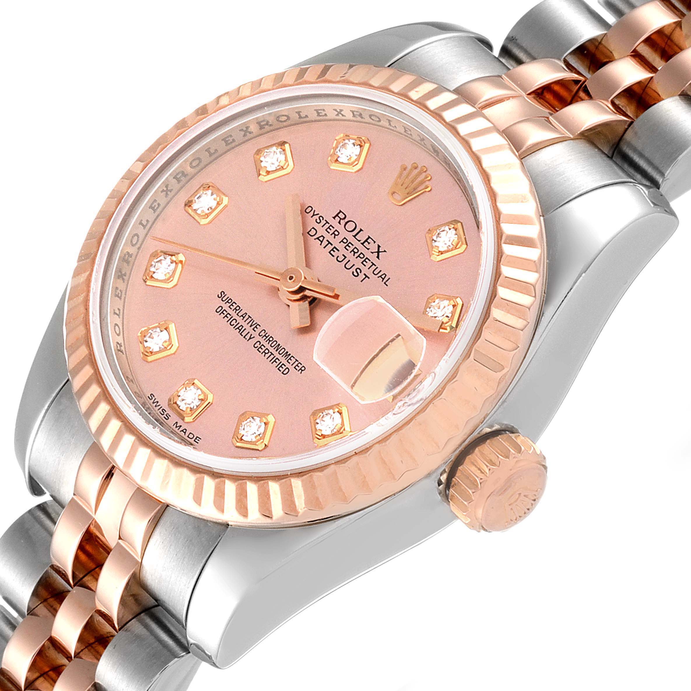 This image shows a close-up angle of a Rolex Datejust 179171 Women's Steel and Gold (two tone) Pink Dial 179171 Women's Steel and Gold (two tone) Pink Dial watch, highlighting the dial, bezel, crown, and part of the bracelet.