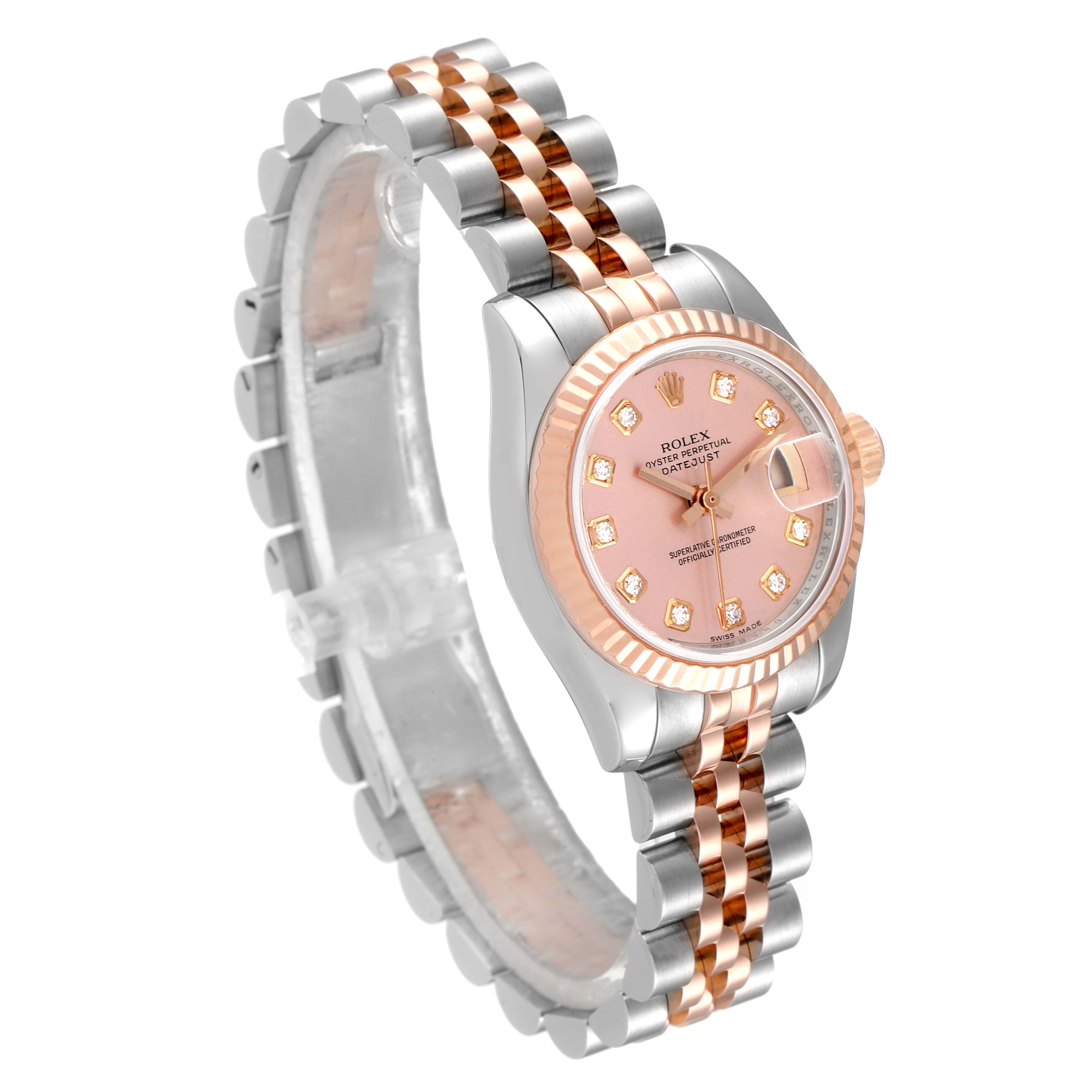 The Rolex Datejust 179171 Women's Steel and Gold (two tone) Pink Dial 179171 Women's Steel and Gold (two tone) Pink Dial watch is shown from a front-left angle, displaying the dial, bezel, and Jubilee bracelet.