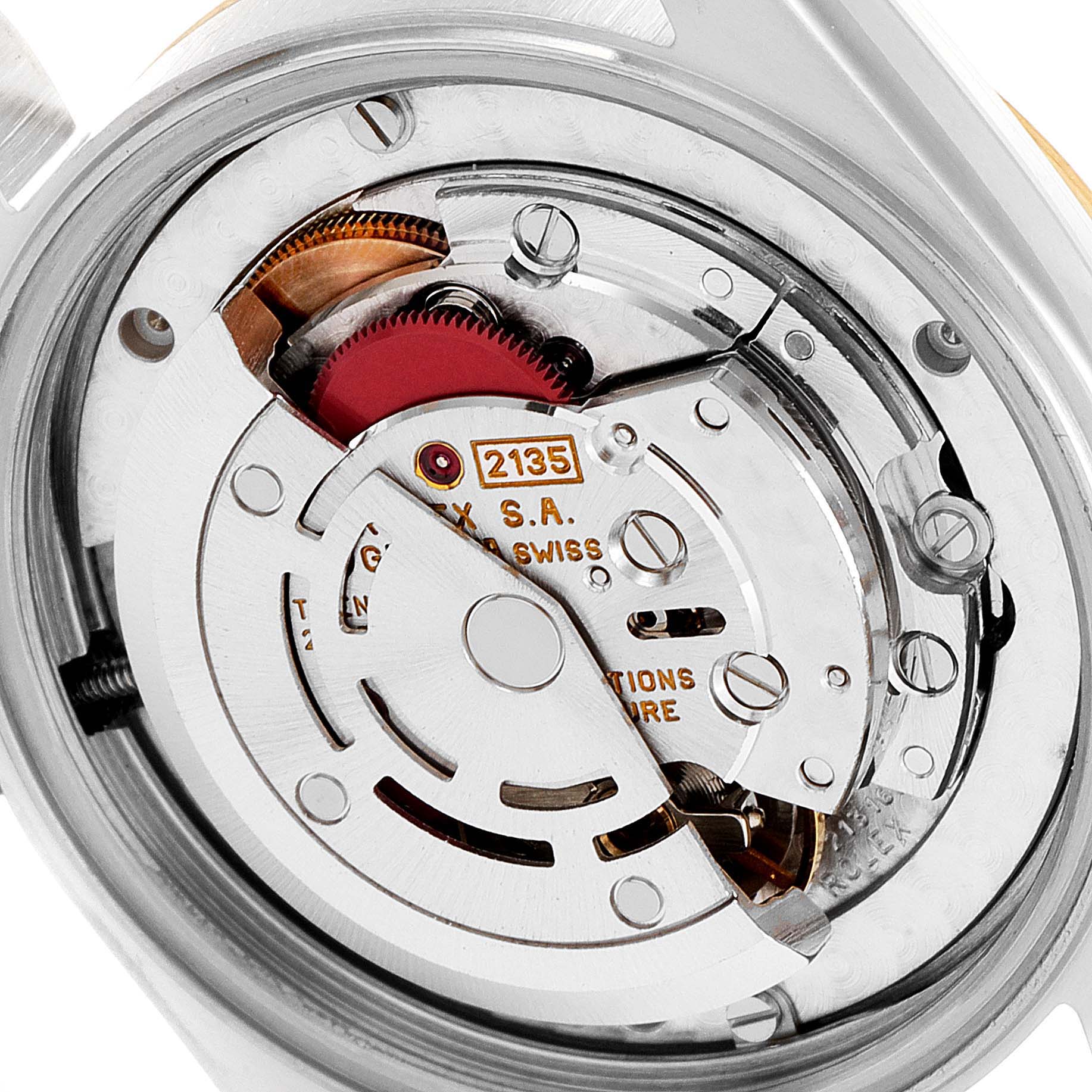 This image shows a close-up view of the movement inside a Mid-Size Rolex watch.