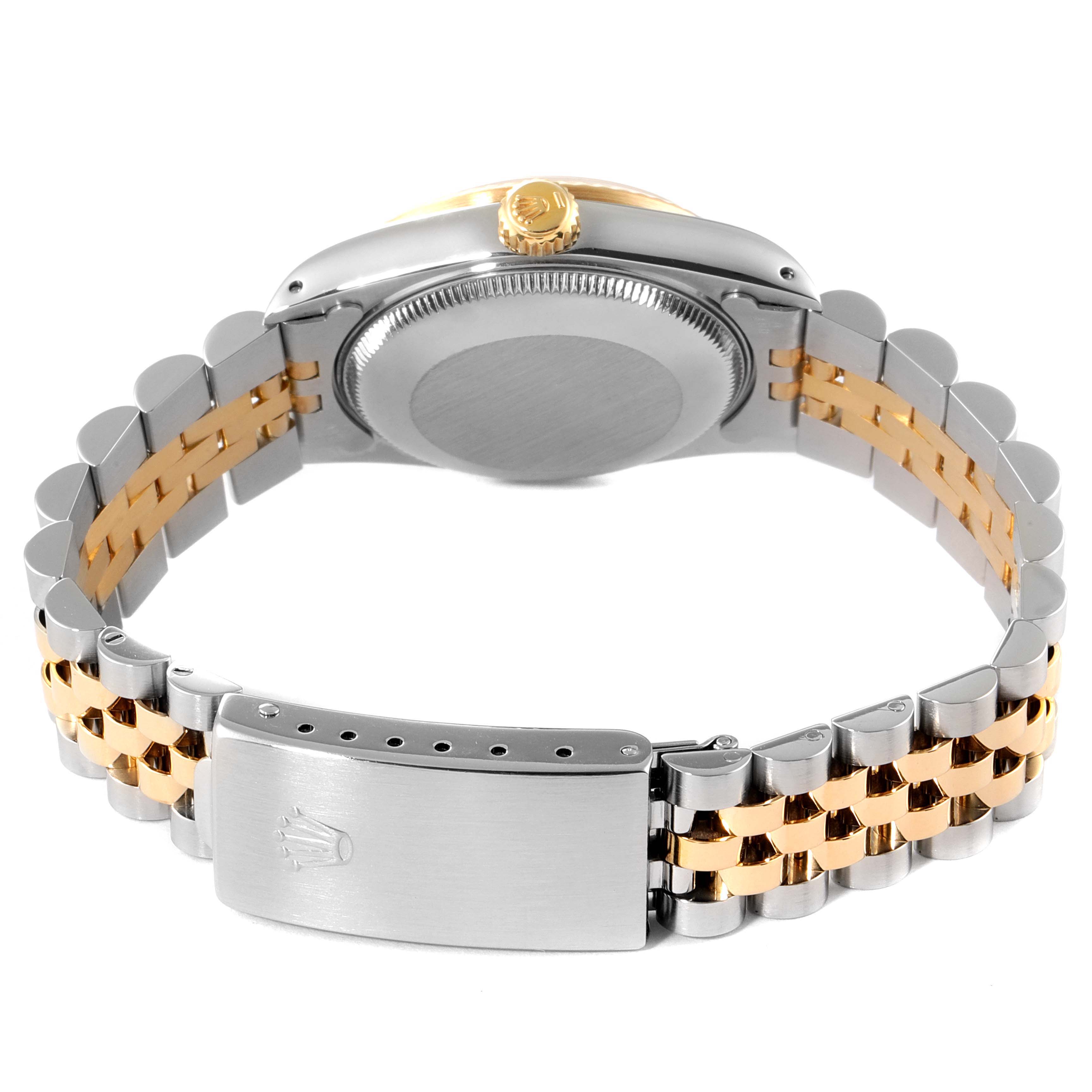 The image shows the back view of the Rolex Mid-Size 68273 Women
s Steel and Gold (two tone) Champagne Dial 68273 Women
s Steel and Gold (two tone) Champagne Dial watch, highlighting the case back, crown, and a two-tone bracelet with a clasp.