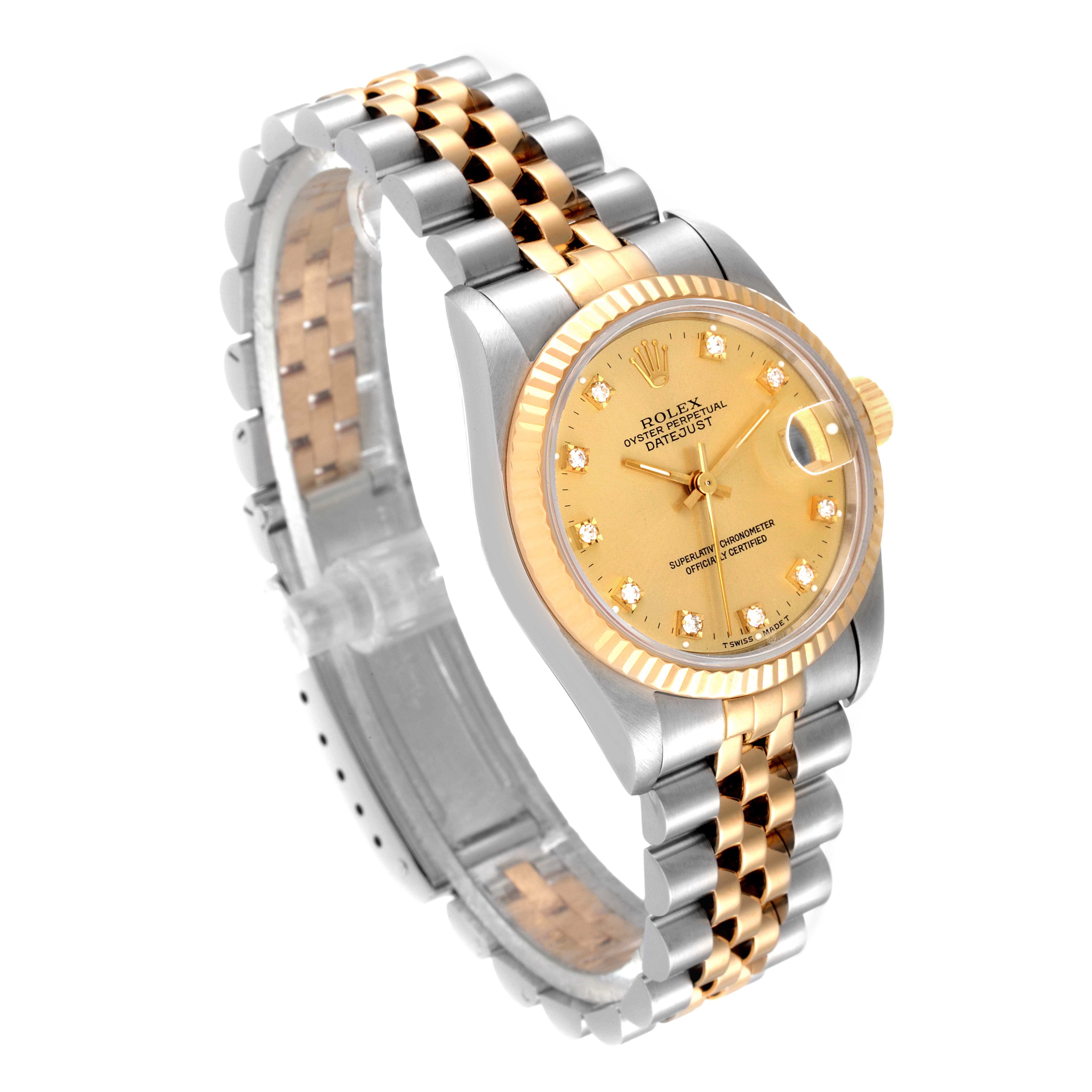 This Rolex Mid-Size 68273 Women
s Steel and Gold (two tone) Champagne Dial 68273 Women
s Steel and Gold (two tone) Champagne Dial watch is shown at an angle highlighting its gold and silver bracelet, fluted bezel, and champagne dial with diamond markers.