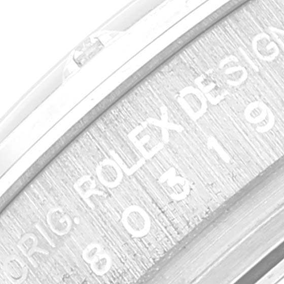 The image shows an angled close-up of the engraving on the case side of the Rolex Pearlmaster 80319 Women's White Gold Silver Dial 80319 Women's White Gold Silver Dial watch.