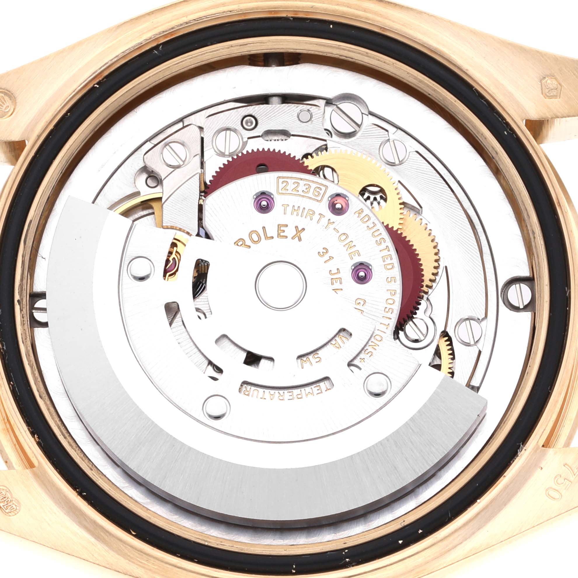 This image shows a close-up of the movement and internal mechanics of a Mid-Size Rolex watch.