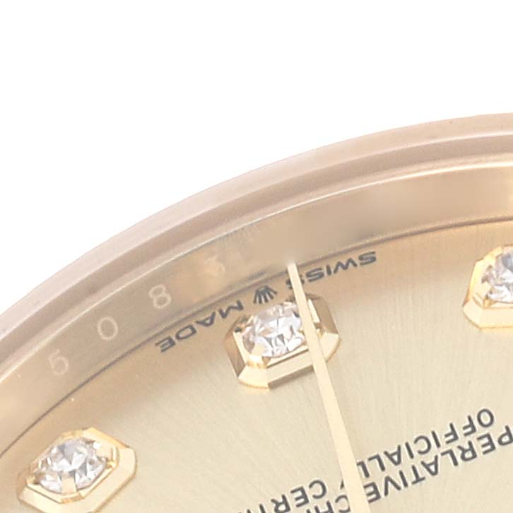 The image shows a close-up view of the face, dial, and diamond markers of a Rolex Mid-Size model watch.