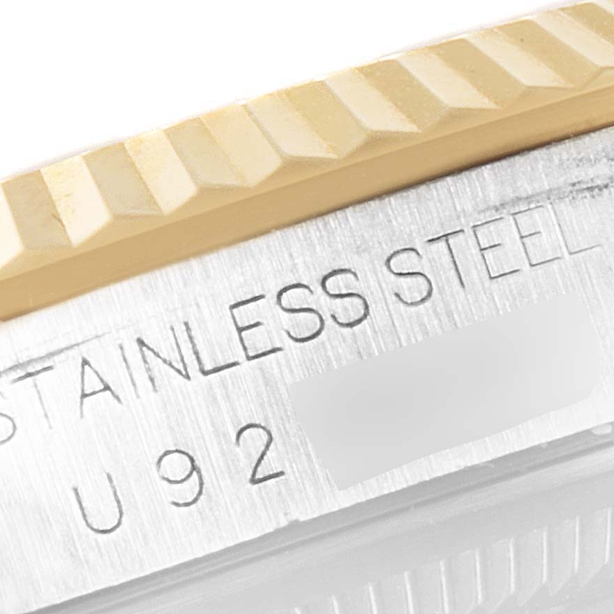 This image shows a close-up of the fluted bezel and stainless steel case of a Rolex Datejust 16233 Men's Steel and Gold (two tone) Silver Dial 16233 Men's Steel and Gold (two tone) Silver Dial watch.