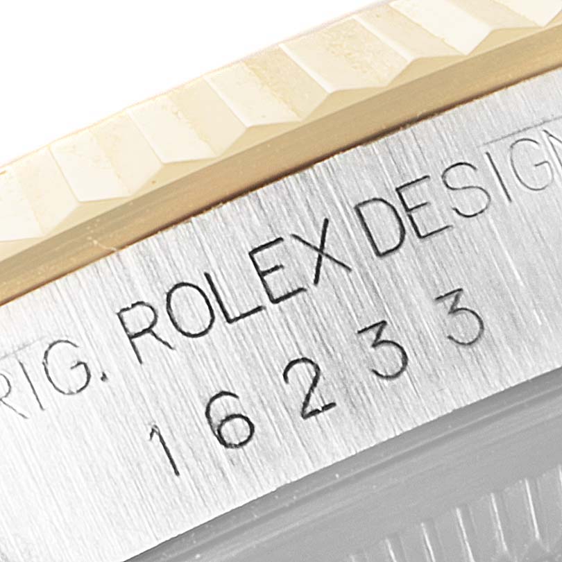 The image shows a close-up of the case edge, including the model number engraved on a Rolex Datejust 16233 Men's Steel and Gold (two tone) Silver Dial 16233 Men's Steel and Gold (two tone) Silver Dial watch.
