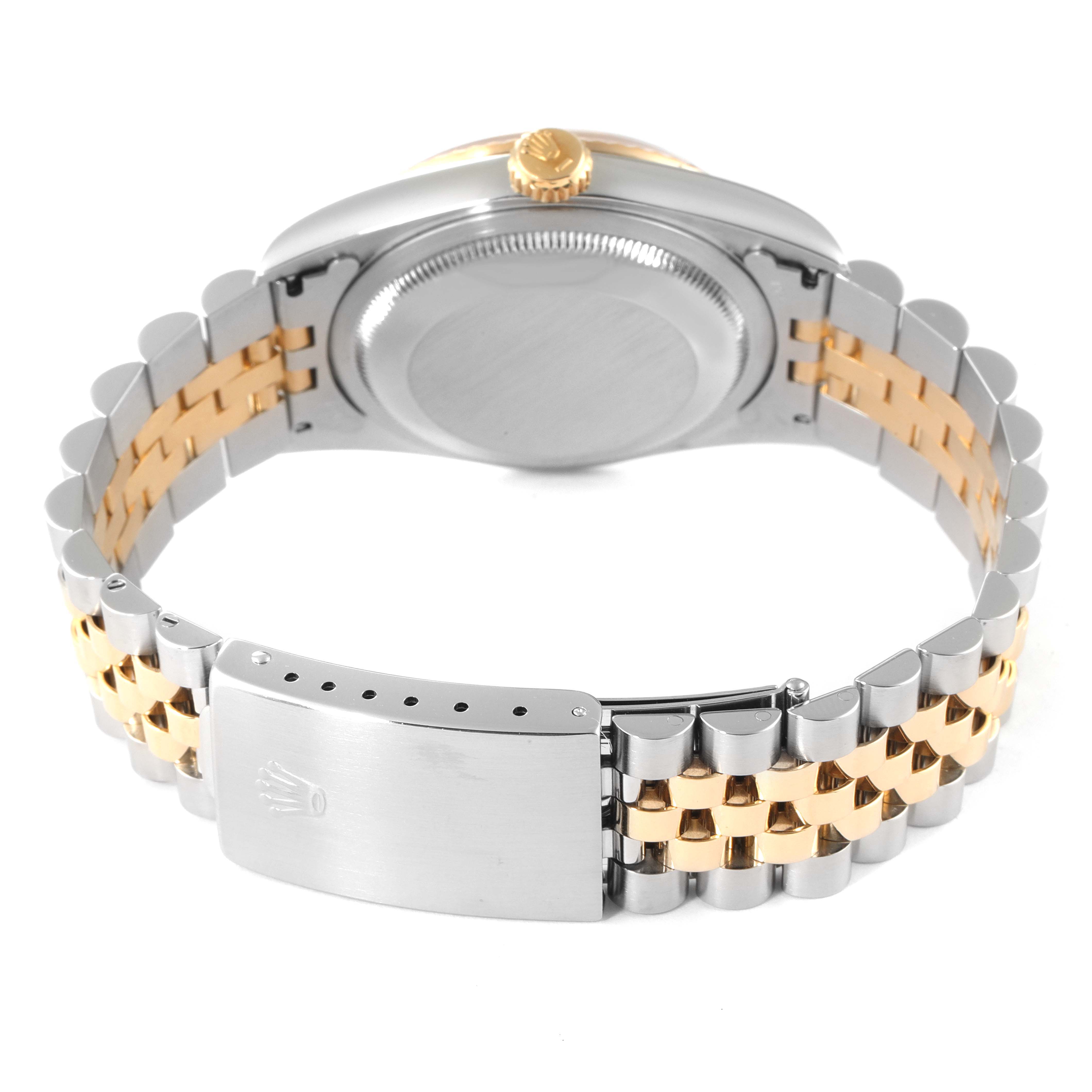 The image shows the back of a Rolex Datejust 16233 Men
s Steel and Gold (two tone) Champagne Dial 16233 Men
s Steel and Gold (two tone) Champagne Dial watch, displaying the case back, crown, and two-tone bracelet with clasp.