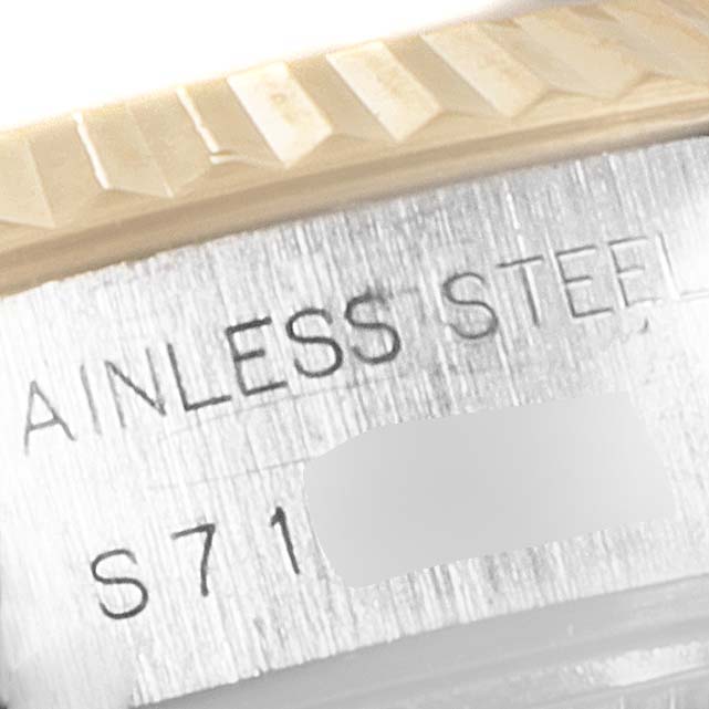 The image shows a close-up of the engraved text on the side of the casing of a Rolex Datejust 69173 Women's Steel and Gold (two tone) White Dial 69173 Women's Steel and Gold (two tone) White Dial watch.