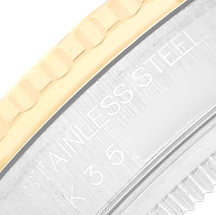 The image shows a close-up of the bezel and part of the case of the Rolex Turn-o-Graph 16263 Men's Steel and Gold (two tone) Champagne Dial 16263 Men's Steel and Gold (two tone) Champagne Dial watch, highlighting the "STAINLESS STEEL" engraving.