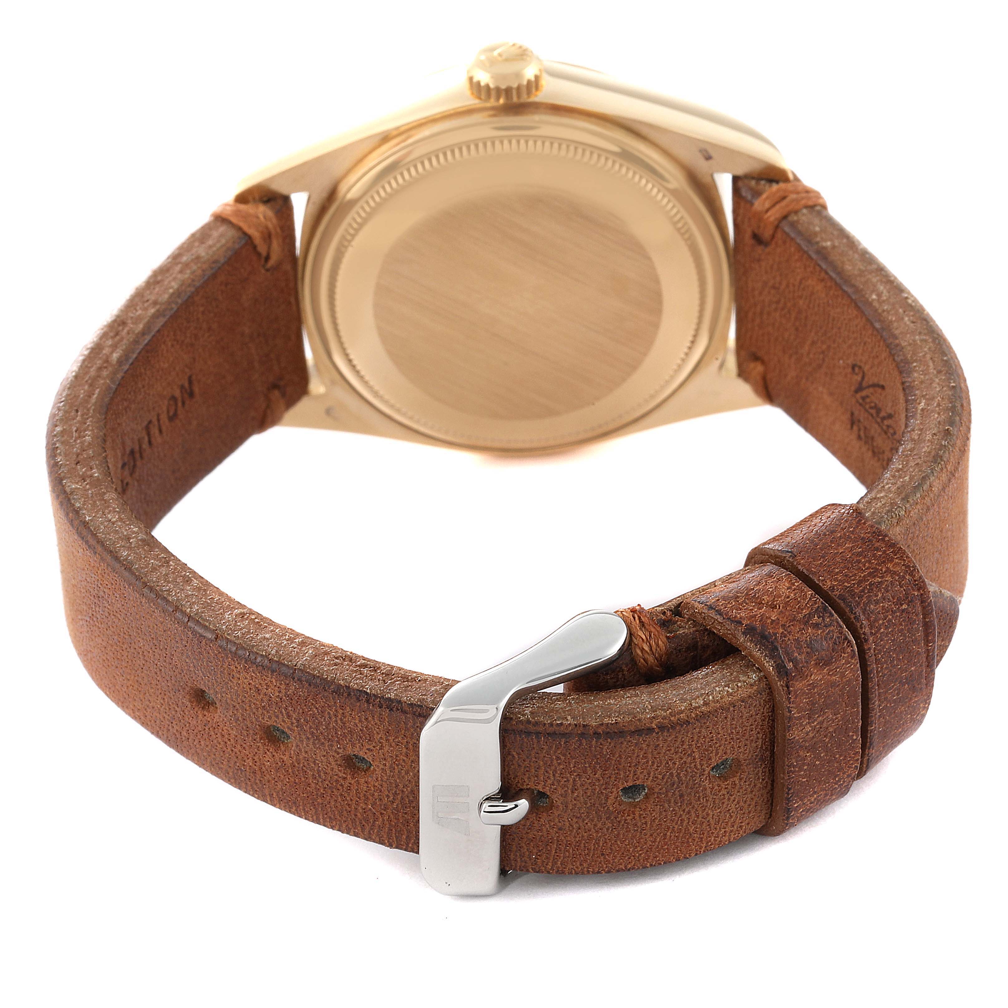 This image shows the back view of a Rolex President 18038 Men's Yellow Gold Champagne Dial 18038 Men's Yellow Gold Champagne Dial watch, featuring its case, crown, and leather strap with a metal buckle.