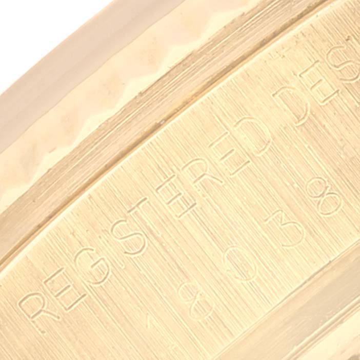 This close-up image shows the engraved detailing on the inner section of a Rolex President 18038 Men's Yellow Gold Champagne Dial 18038 Men's Yellow Gold Champagne Dial watch case.