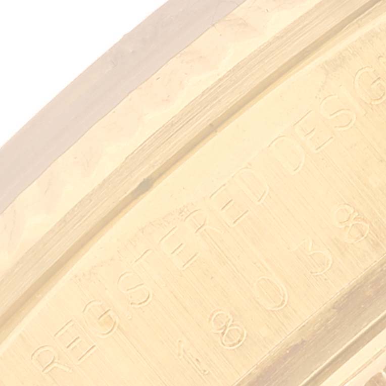 The image shows an engraved inscription on the inner side of the casing of a Rolex President 18038 Men's Yellow Gold Champagne Dial 18038 Men's Yellow Gold Champagne Dial model watch.