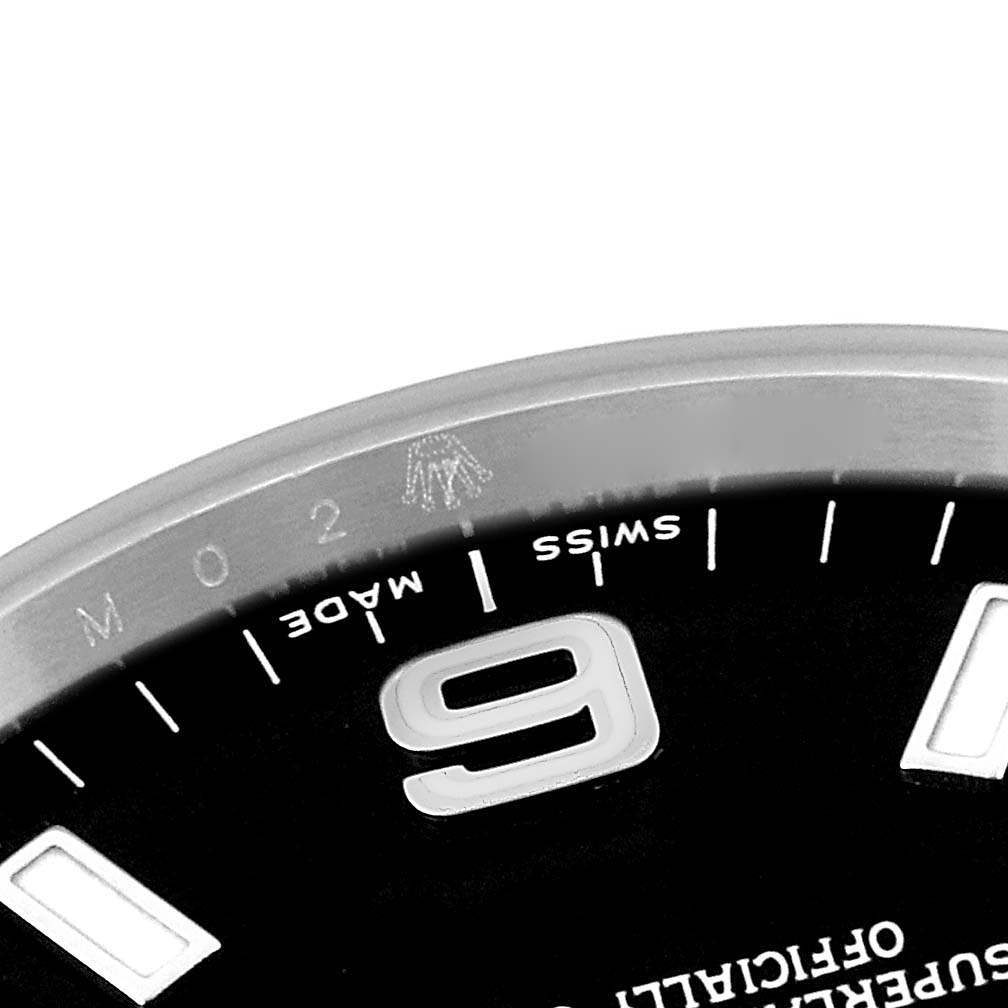 The image shows a close-up of the dial and bezel of a Rolex Explorer 114270 Men's Stainless Steel Black Dial 114270 Men's Stainless Steel Black Dial watch, highlighting the '9' hour marker and text.