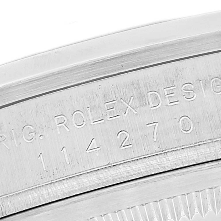 This close-up image shows the engraved model number "114270" on the side of a Rolex Explorer 114270 Men
s Stainless Steel Black Dial 114270 Men
s Stainless Steel Black Dial watch.