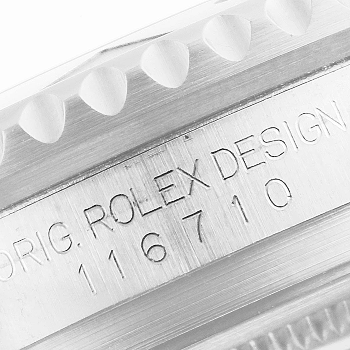 Close-up view of the side casing of a Rolex GMT-Master 116710 Men
s Stainless Steel Black Dial 116710 Men
s Stainless Steel Black Dial, showing the model number 116710 and "ROLEX DESIGN" engraving.