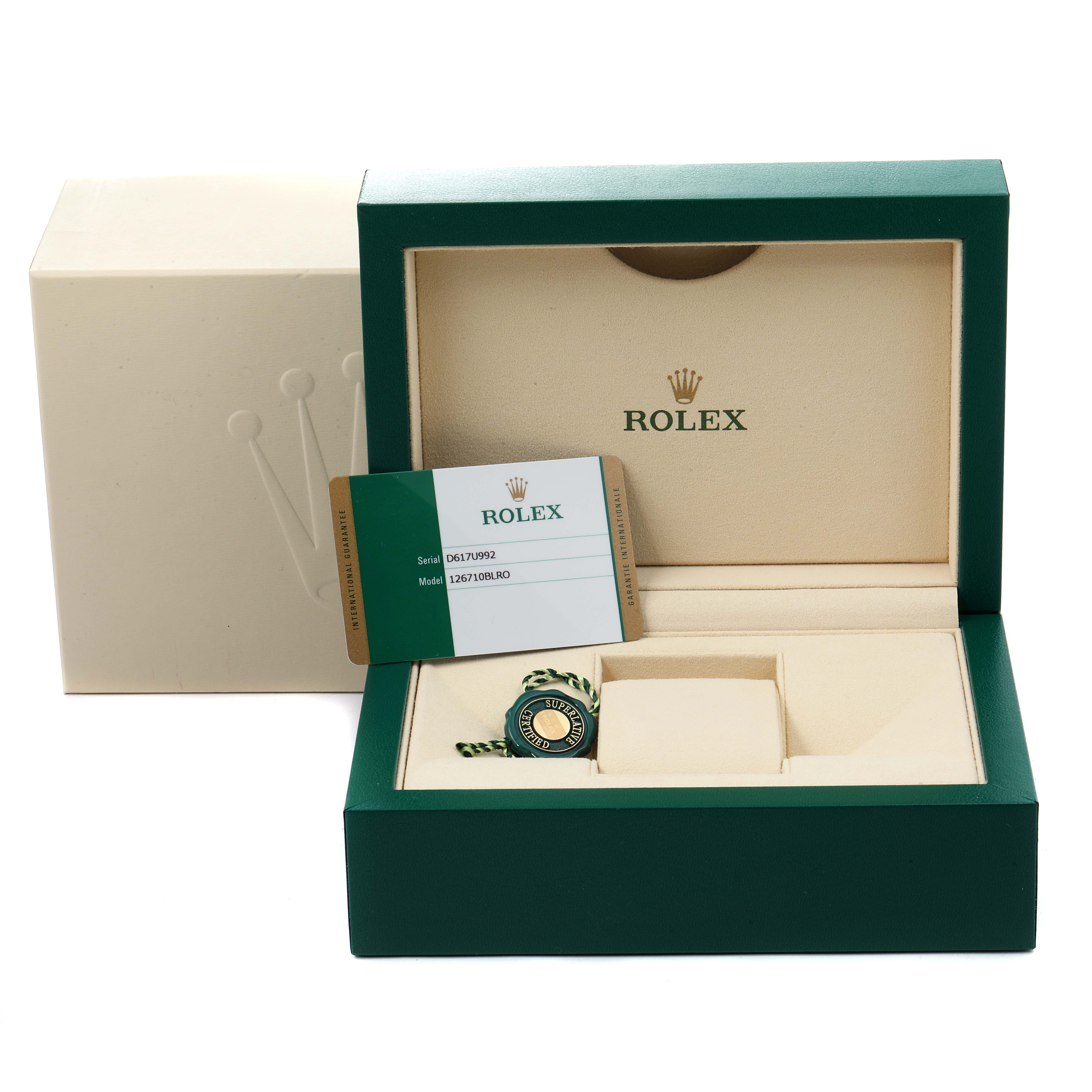 The image shows the packaging, warranty card, and tag for a Rolex GMT-Master 126710 Men's Stainless Steel Black Dial 126710 Men's Stainless Steel Black Dial.