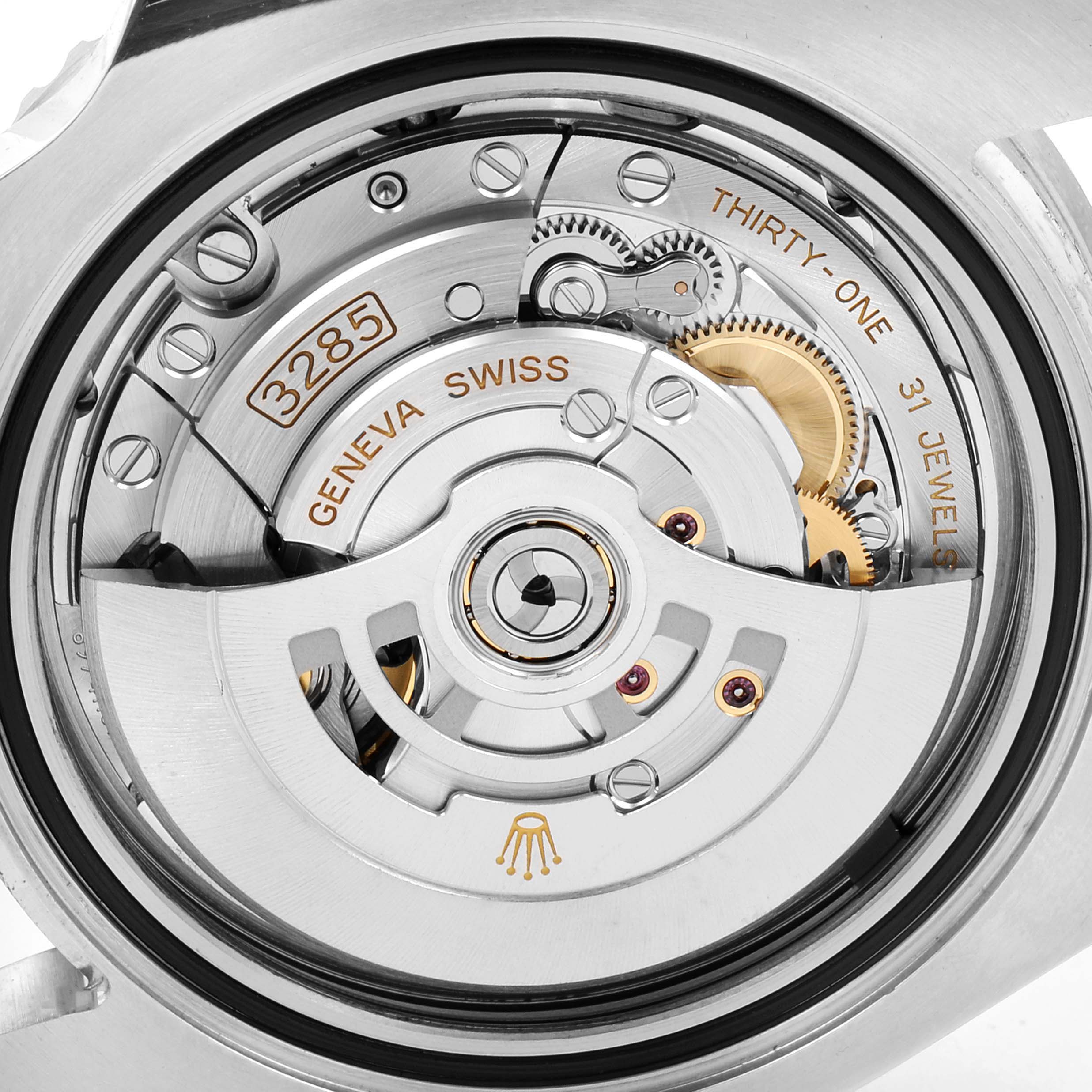 This image shows the movement mechanism of the Rolex GMT-Master 126710 Men's Stainless Steel Black Dial 126710 Men's Stainless Steel Black Dial watch, highlighting the intricate gears and inscriptions.