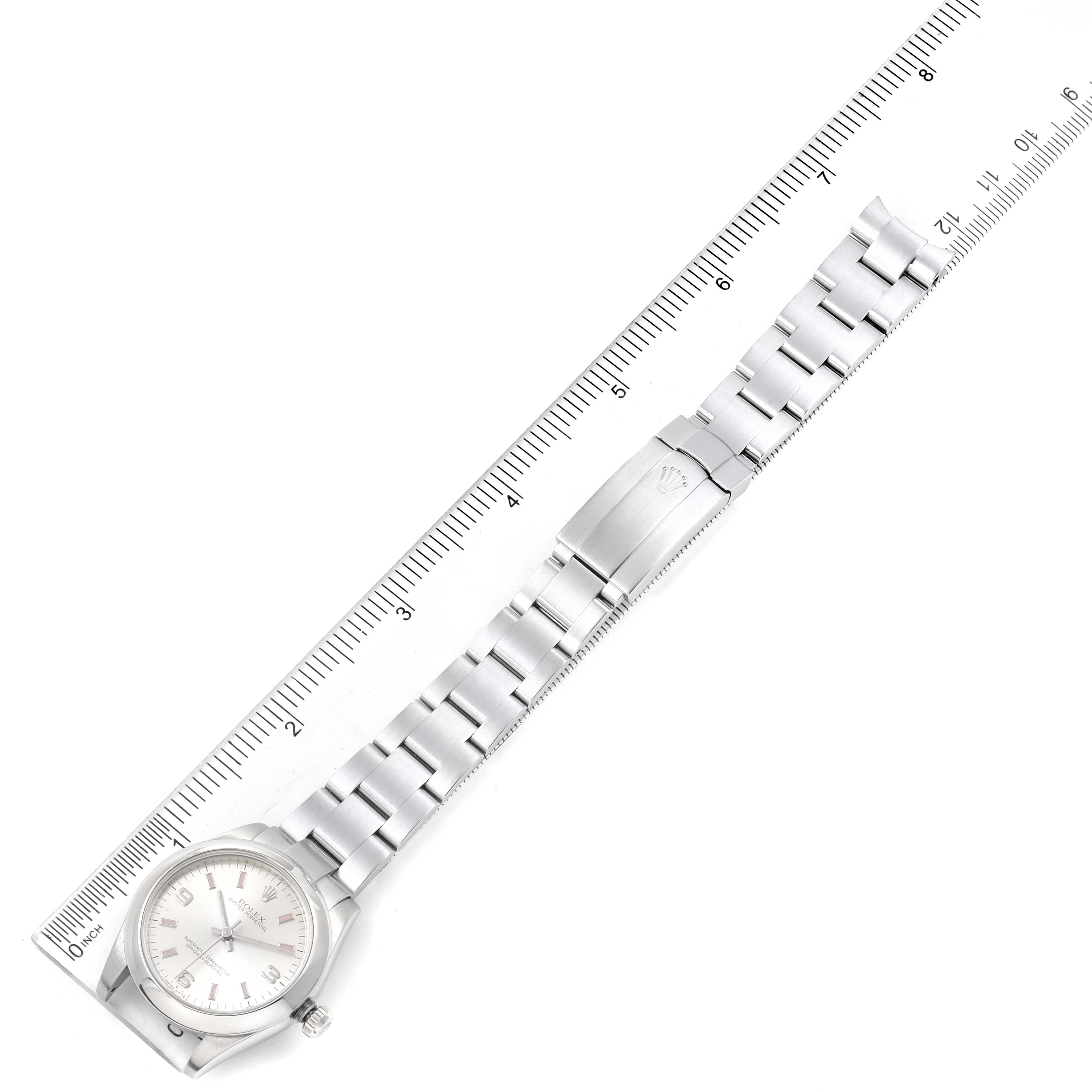 The image shows a Rolex Mid-Size 177200 Women's Stainless Steel Silver Dial 177200 Women's Stainless Steel Silver Dial watch laid flat, including the entire bracelet and part of a ruler for scale.