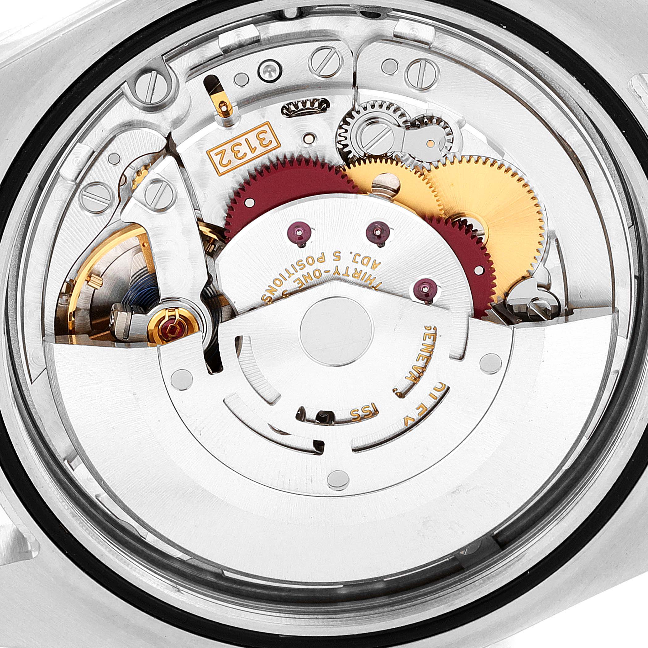 This image shows the movement and inner workings of a Rolex Oyster Perpetual 114300 Men's Stainless Steel Grey Dial 114300 Men's Stainless Steel Grey Dial watch.