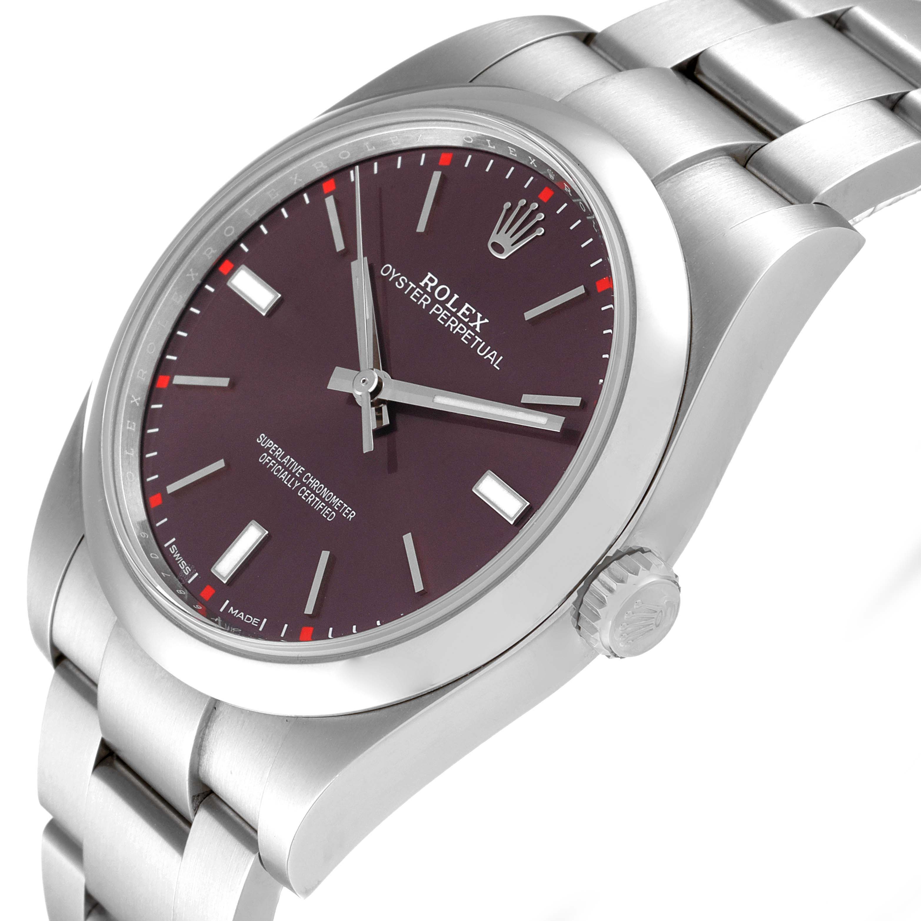 The image shows a Rolex Oyster Perpetual 114300 Men
s Stainless Steel Burgundy Dial 114300 Men
s Stainless Steel Burgundy Dial watch at an angled close-up, highlighting the dial, crown, and part of the bracelet.