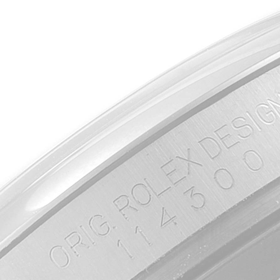 This image shows a close-up view of the engraved model number on the side of the Rolex Oyster Perpetual 114300 Men
s Stainless Steel Burgundy Dial 114300 Men
s Stainless Steel Burgundy Dial case.