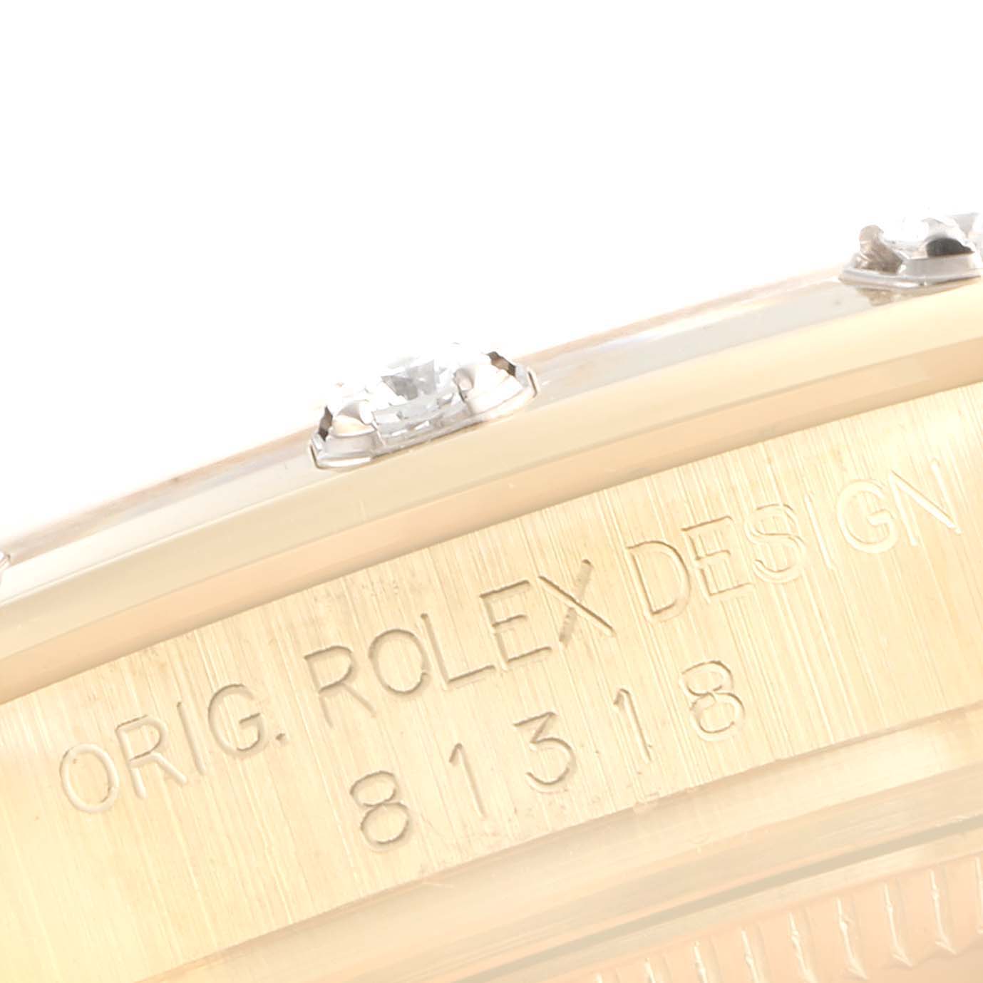 This image shows a close-up of the side of the Rolex Pearlmaster 81318 Women's Yellow Gold Mother of Pearl Dial 81318 Women's Yellow Gold Mother of Pearl Dial watch, highlighting the engraved design details.