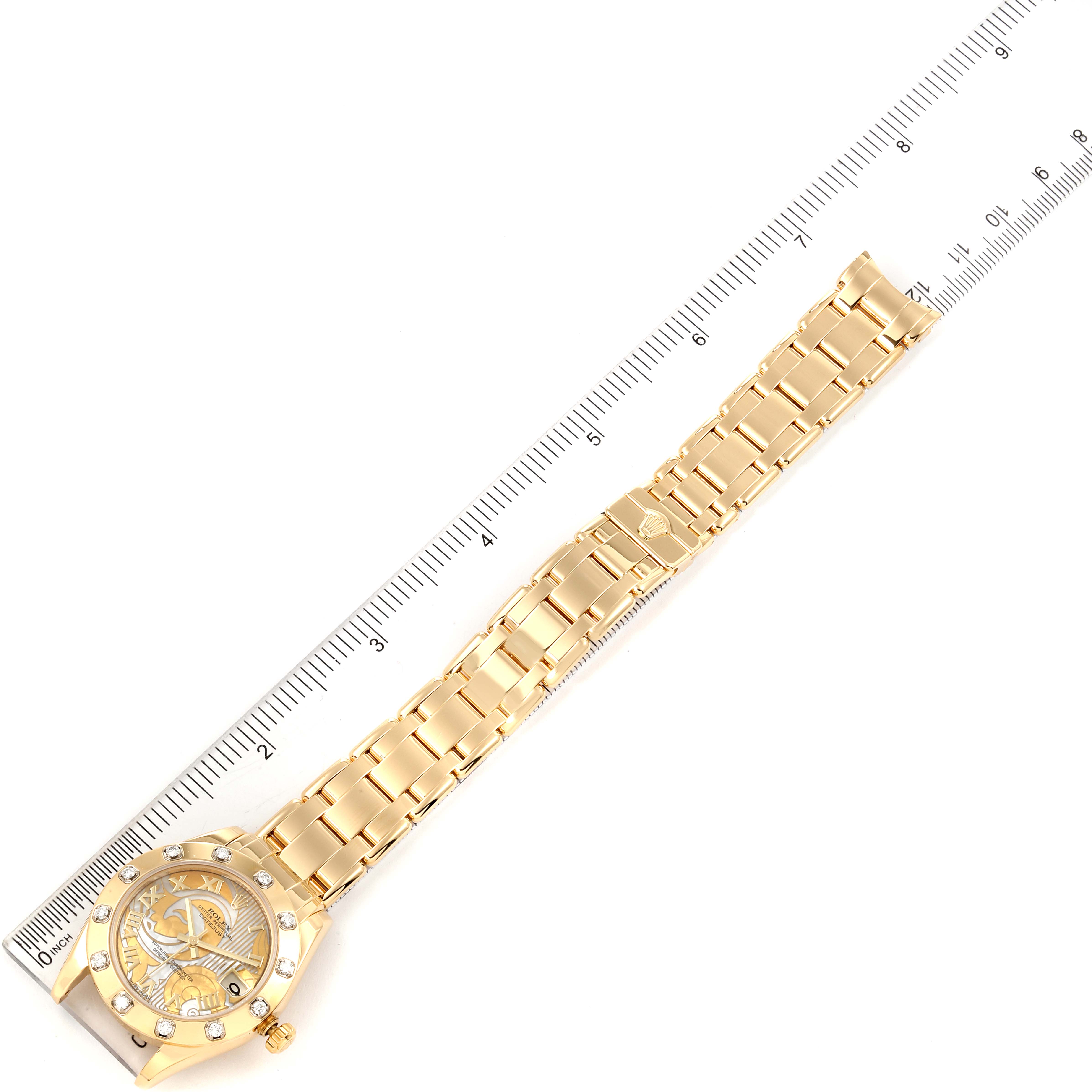 This image shows a Rolex Pearlmaster 81318 Women's Yellow Gold Mother of Pearl Dial 81318 Women's Yellow Gold Mother of Pearl Dial watch, including the watch face and entire band, aligned next to a ruler for measurement.