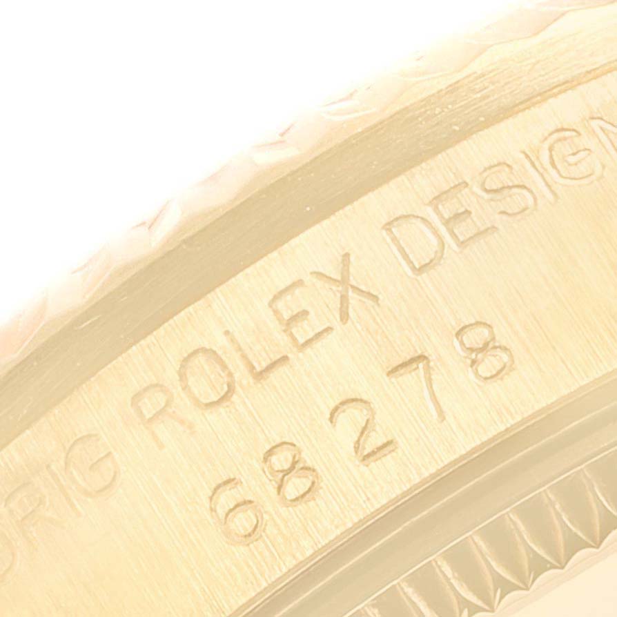 The image shows the engraved side bezel of a Rolex President 68278 Women
s Yellow Gold Champagne Dial 68278 Women
s Yellow Gold Champagne Dial model watch, displaying the model number "68278".