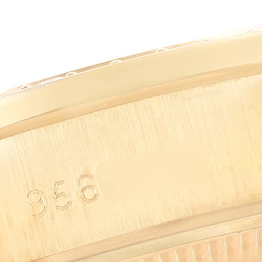This image shows a close-up of the side of a Rolex President 69138 Women's Yellow Gold Champagne Dial 69138 Women's Yellow Gold Champagne Dial watch model, highlighting the serial number.