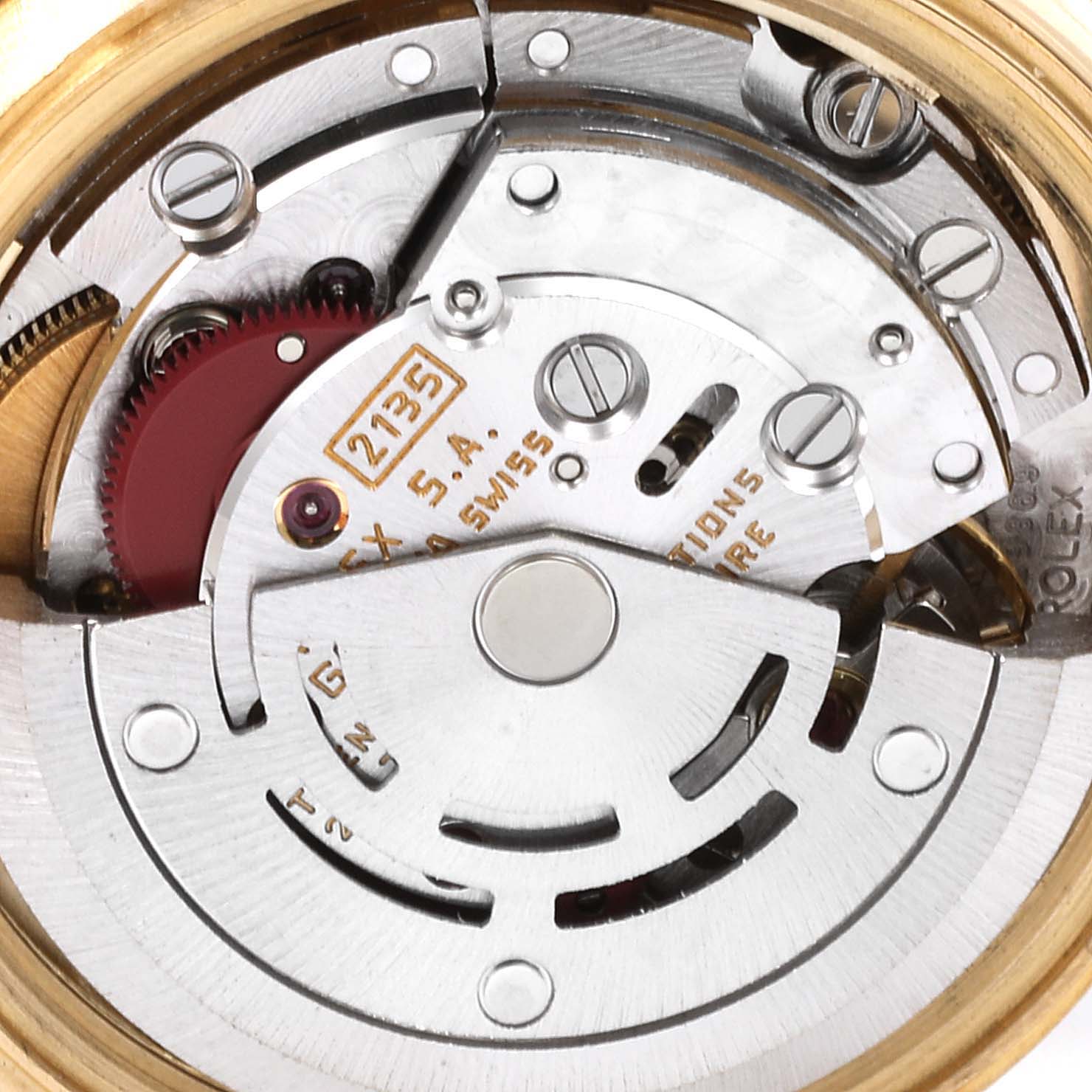 The image shows a close-up view of the movement mechanism of a Rolex President 69138 Women's Yellow Gold Champagne Dial 69138 Women's Yellow Gold Champagne Dial model watch.