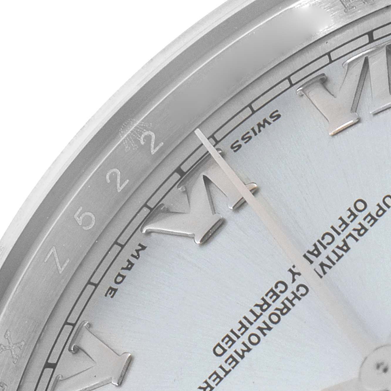 The image shows a close-up of the Rolex President 118206 Men's Platinum Blue Dial 118206 Men's Platinum Blue Dial watch's dial and bezel angled to highlight the Roman numeral markers and inscriptions.