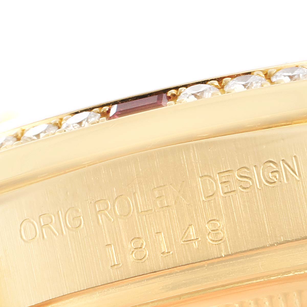 The image shows a close-up angle of the casing of a Rolex President 18148 Men's Yellow Gold Champagne Dial 18148 Men's Yellow Gold Champagne Dial model watch, highlighting its design and serial number.
