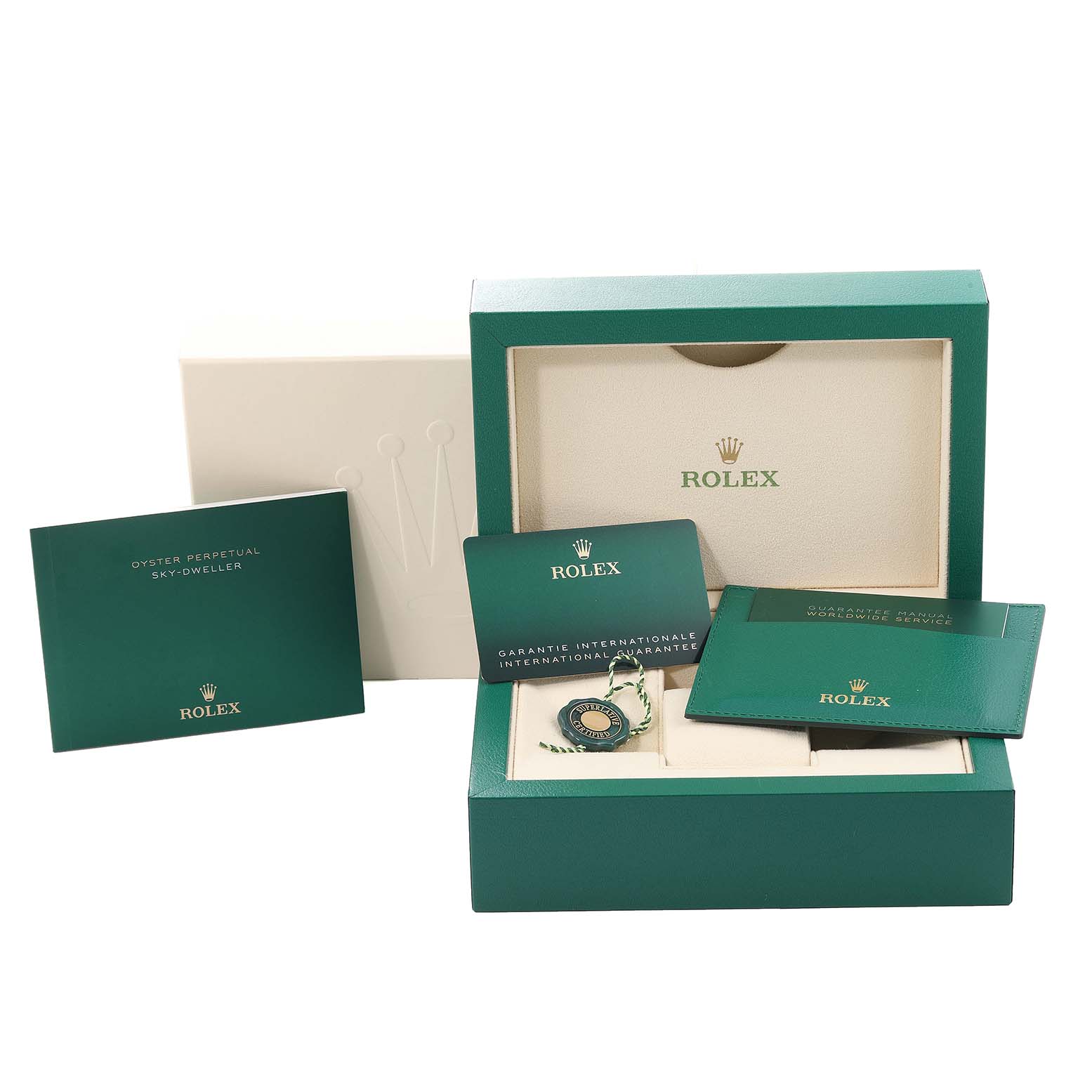 The image shows the packaging and accessories for a Rolex Sky-Dweller 326933 Men's Steel and Gold (two tone) Champagne Dial 326933 Men's Steel and Gold (two tone) Champagne Dial, including the watch box, manuals, and warranty card.